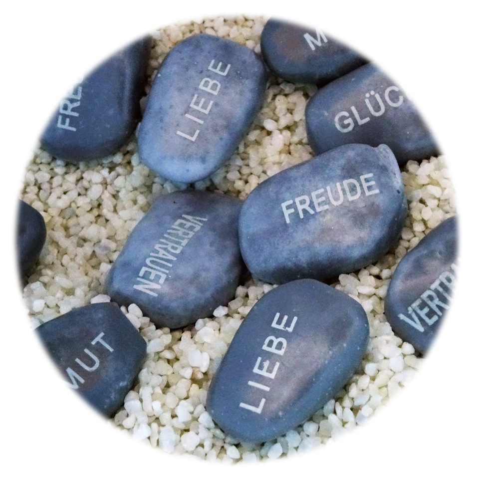 Inspirational stones with words such as love, joy and trust